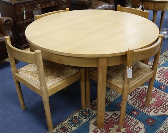 A Conran circular ash table and a set of four rush-seat chairs W.122cm